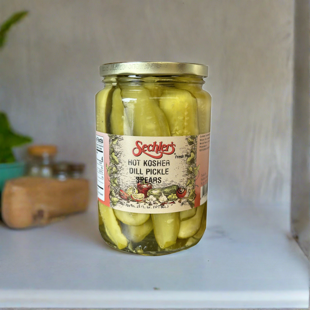 Jar of Hot Kosher Dill Pickle Spears inside kitchen cabinet.